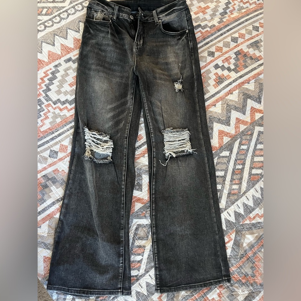 Distressed acid wash black jeans